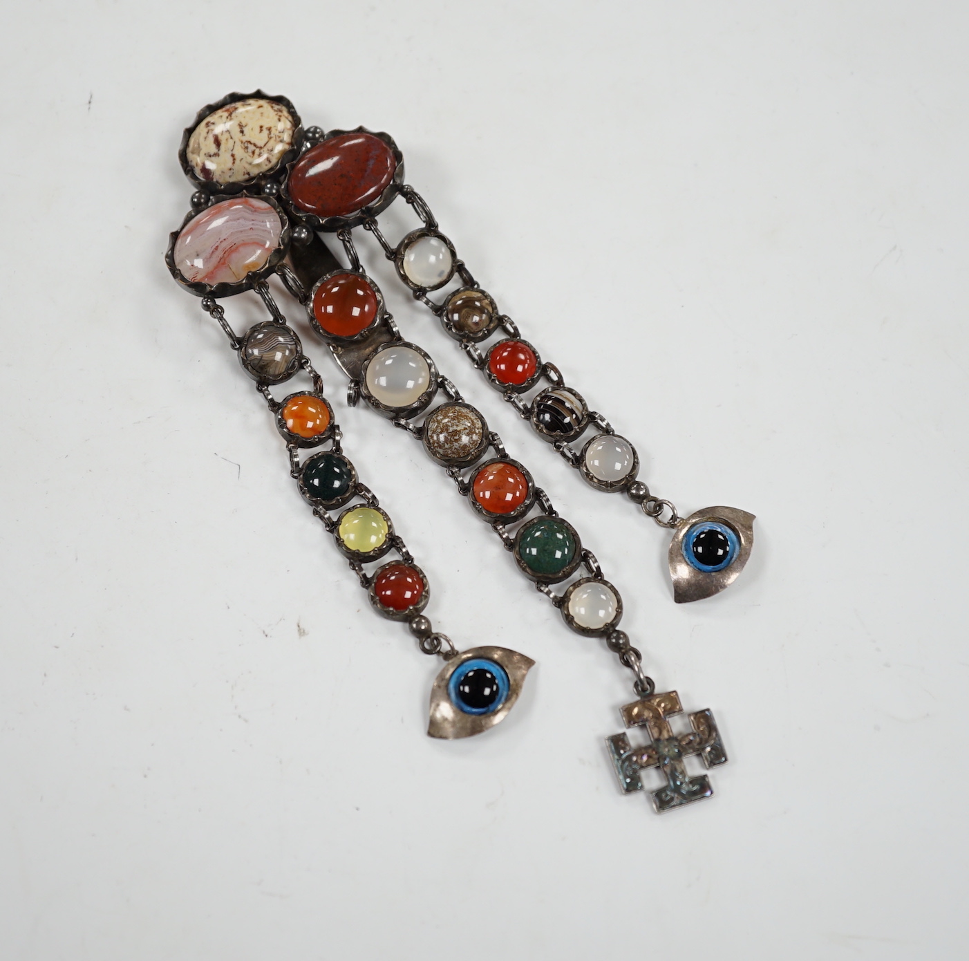 A white metal and cabochon multi gem set chatelaine, including jasper, carnelian and banded agate, 17cm.